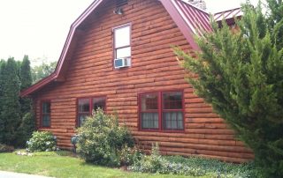 cabin home with red roof restored